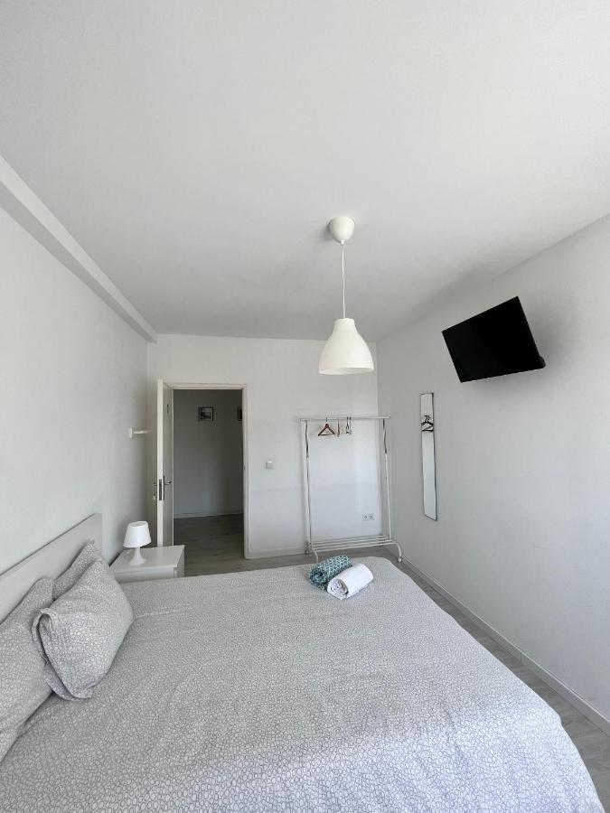 Quarto Triplo com Banheiro Compartilhado