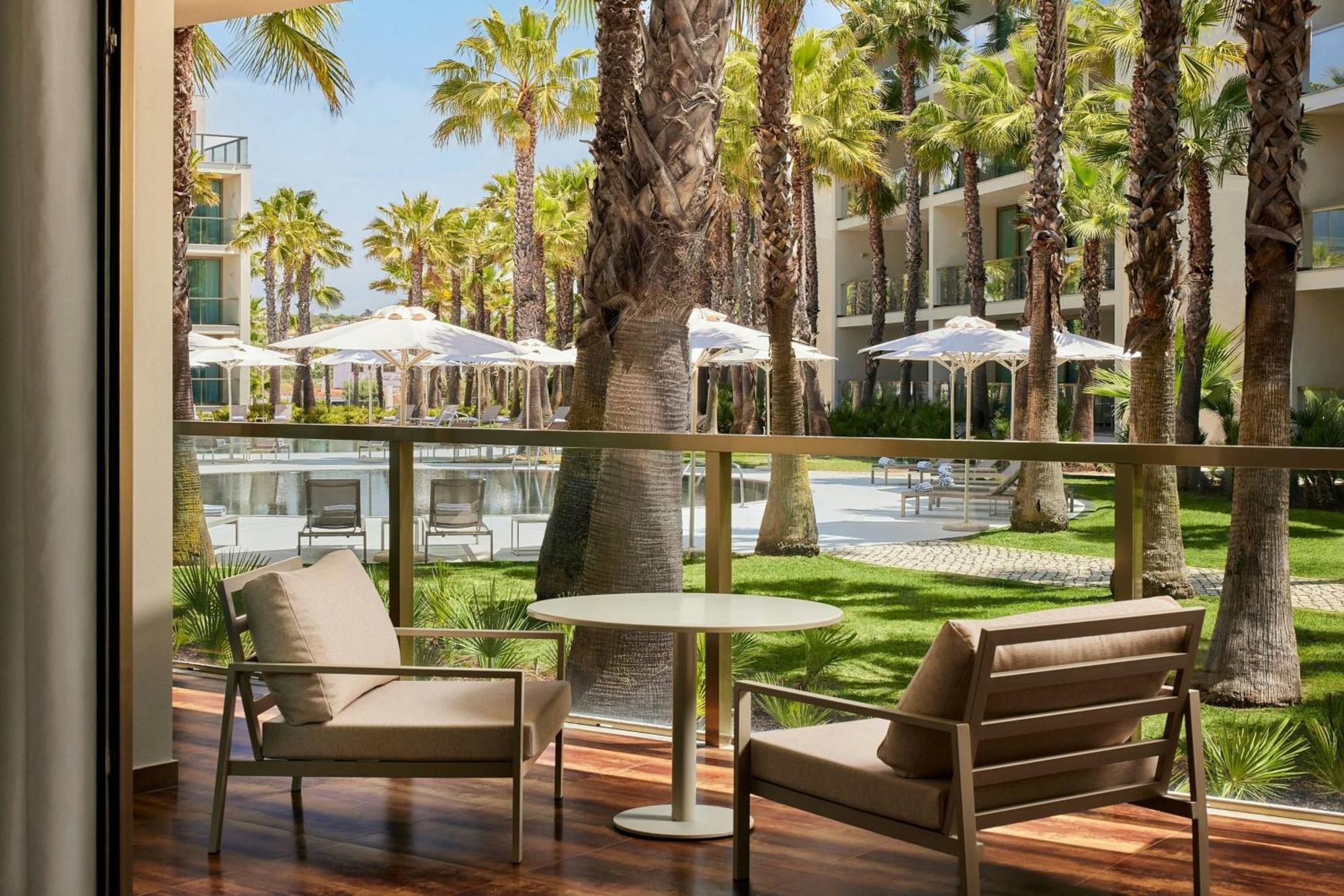 One-Bedroom King Suite Balcony Pool View