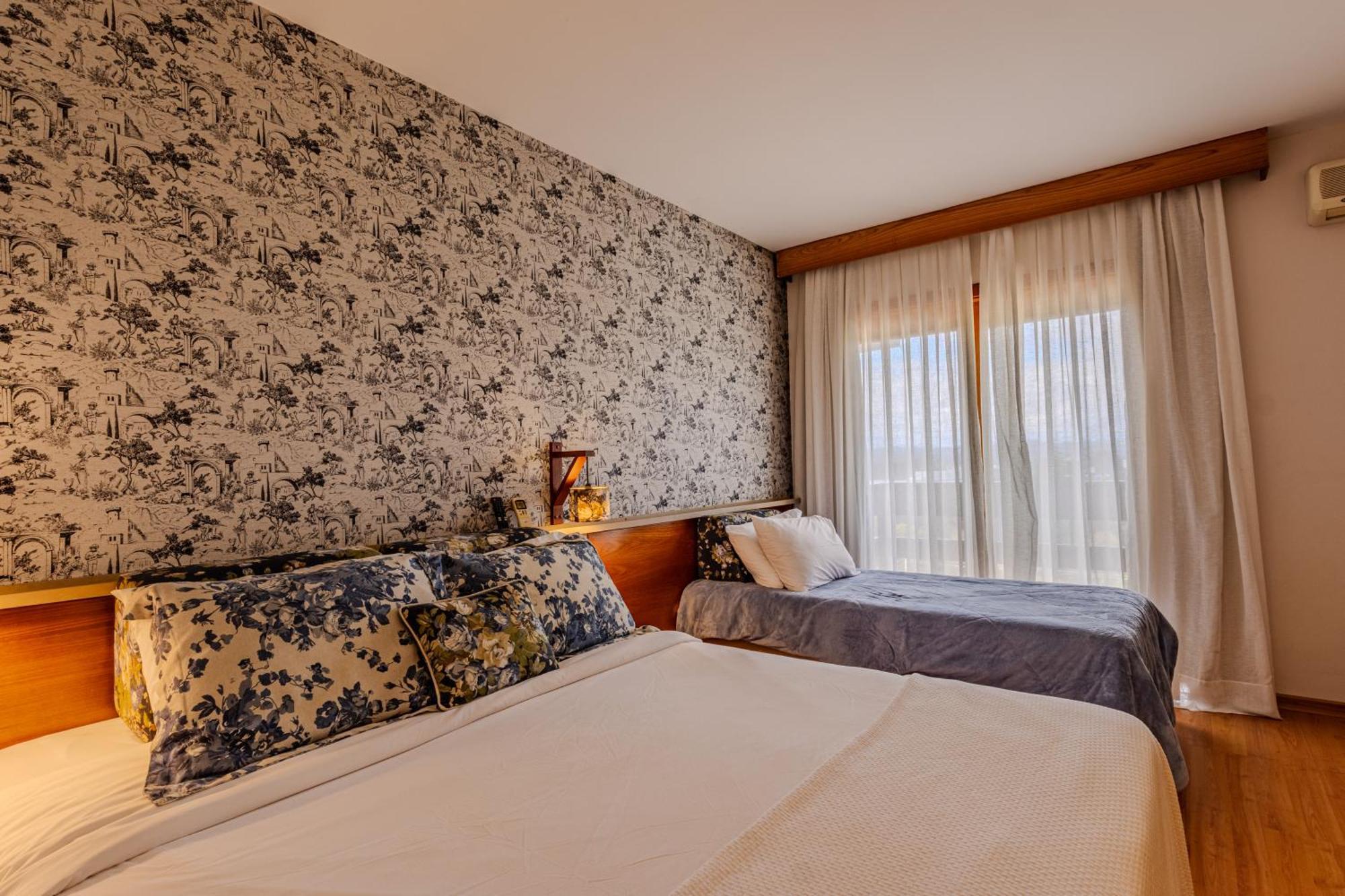 Quarto Quádruplo Premium